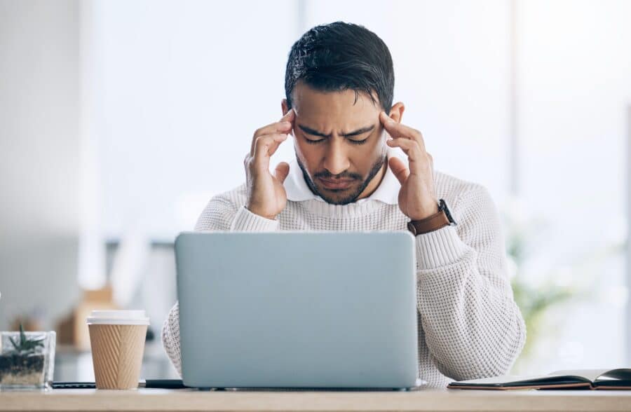 Work, stress and burnout, man at computer reading spam email, glitch or 404 error in office. Headac