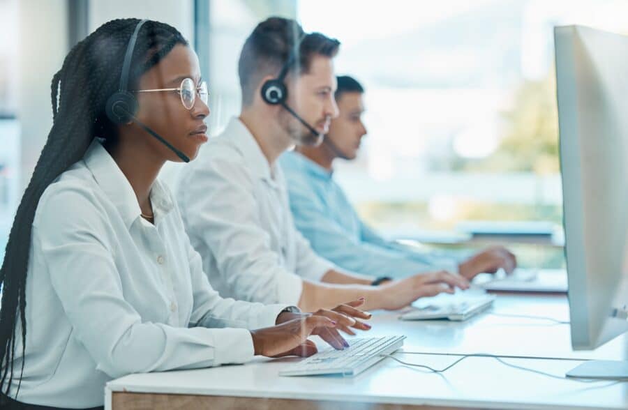 Contact us, telemarketing and crm, black woman at computer in customer service team with headset. H