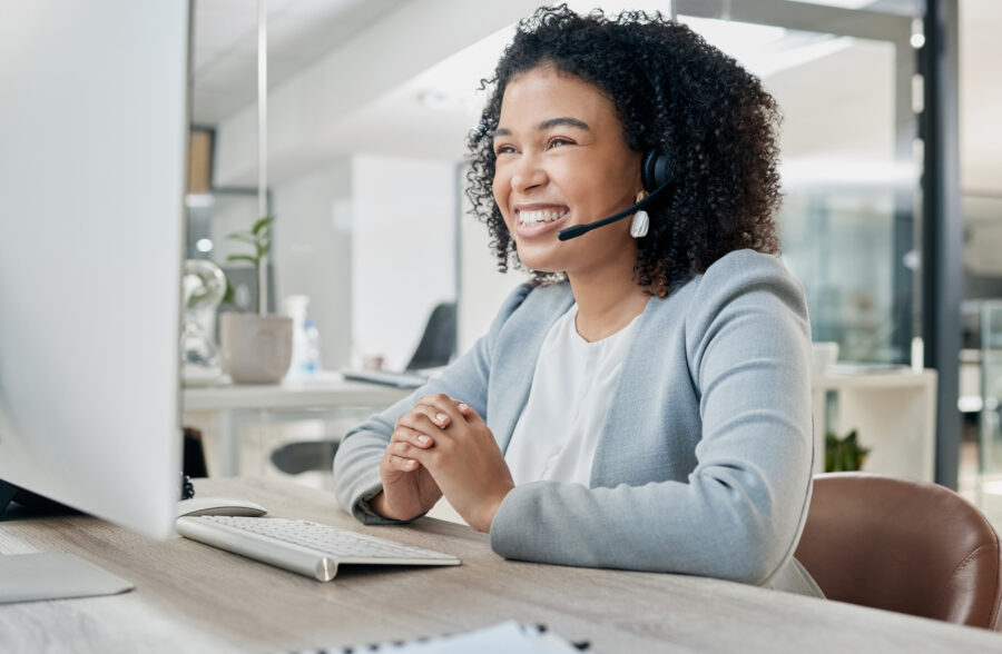 Black woman, call center and computer with CRM and contact us, phone call with customer service or