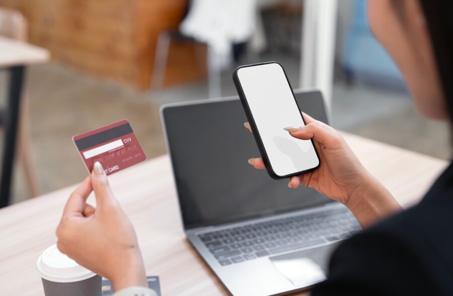 Online payment, Hands of woman holding mobile phone and using credit card for online shopping